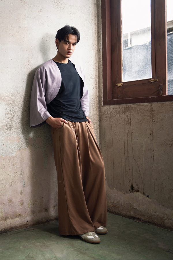 Finix FLOW Box Pleat Wide Leg Joggers in Mocha Brown – front view, model posing.