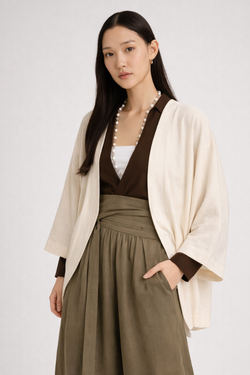 Woman wearing a Japanese style kimono Cocoon Jacket in Oat White