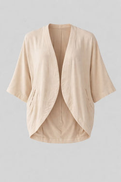 Oat white kimono-style cocoon shape jacket on a light gray background