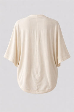 Oat white kimono-style cocoon shape jacket on a light gray background